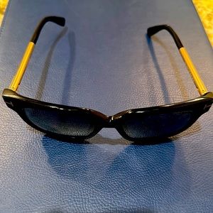 Black and gold reflective Tom Ford sunglasses